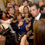 Reporters surround Sen. Ted Cruz in the Capitol.