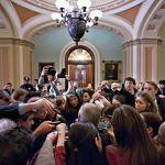 Reporters surround Sen. Dick Durben in the Capitol. | USNews