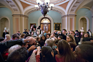 Reporters surround Sen. Dick Durben in the Capitol. | U.S. News & World Report